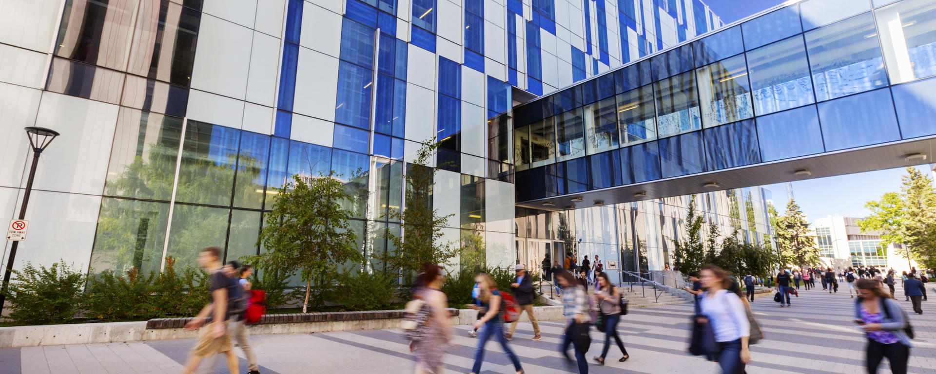 People walking outside of TFDL building