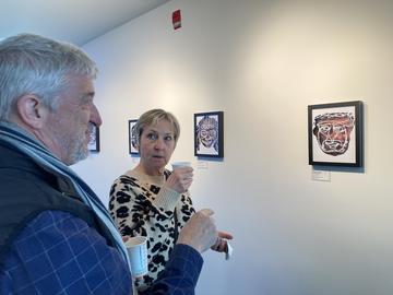 Enjoying artwork at Contemporary Calgary exhibition.