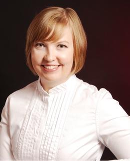 photo of blonde white woman on dark background