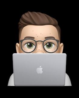 Memoji of Meghan with laptop