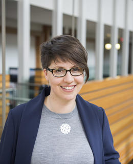 Professional photo of staff member standing in the Taylor Institute for Teaching and Learning