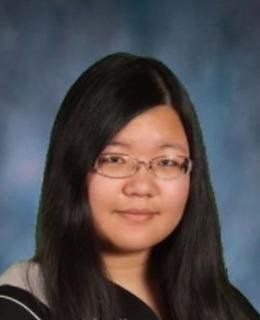 a graduation photo of a smiling young woman in her twenties, with medium-long dark hair and glasses