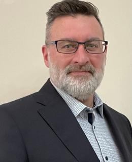 head shot, male, Caucasian, dark hair, grey beard, glasses