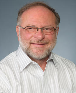 Tom aged 65 - white beard and white shirt but not a dead white guy - yet