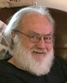 Head-shot of white-bearded Dr. Bill in 2019.