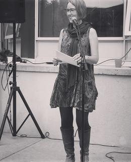 A photo of Jackie Seidel reading poetry at the People's Poetry Festival in Calgary, Alberta, Canada (September 2019)