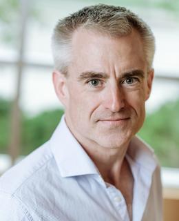 Headshot of Andrew North