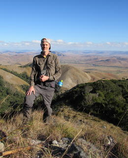Dr. Johnson smiling at the camera overlooking the Ivohibory 'Lost Forest' in southeastern Madagascar
