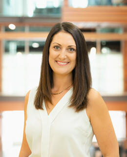 woman with brown hair smiling