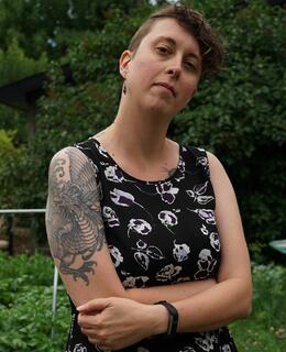 Person standing in greenery