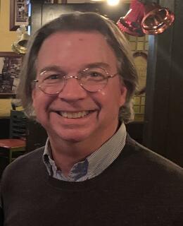 Dr. Wilkinson smiling at a Department Event