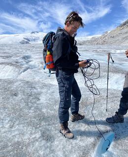 Liam conducting field work on a Glacier