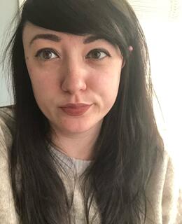 Selfie of Mariann, a woman with long brown hair.