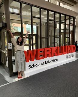 Instructor with Werklund Education Sign