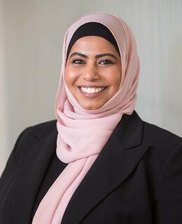 Woman smiling wearing a headscarf