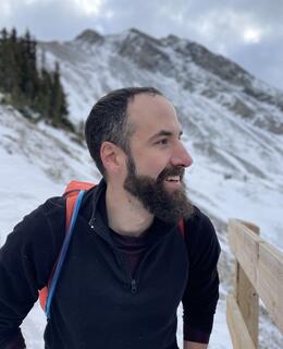 Thomas in his natural environment, hiking in the mountains.
