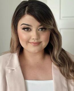 Woman in pink blazer