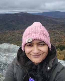 Profile picture of a woman on a hill