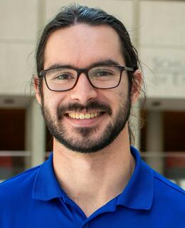 Very handsome man in glasses and blue shirt