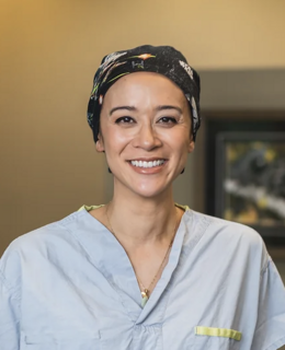 Photo of Dr. Hartley in scrub top and surgical hat