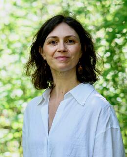 Dr. Lawless standing in a forest.