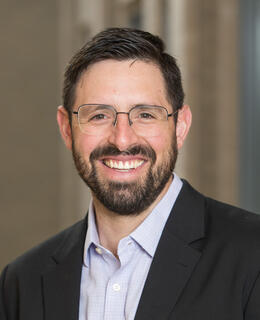 Ulises' face picture. Light skin with glasses, and dark brown short hair and beard.