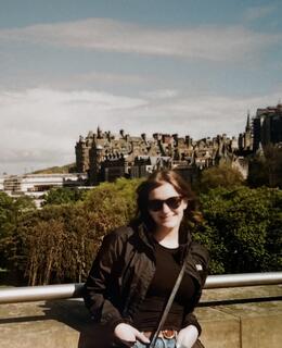 A picture of Bianca standing in Edinburgh, Scotland. 