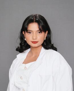 Muse in a white lab coat