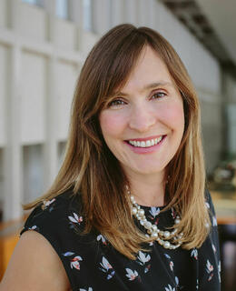 Gillian smiling in the TI building