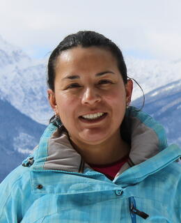 Headshot with snowy mountains on the background