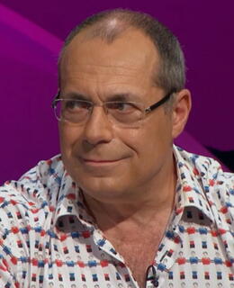 man with eyeglasses & wearing a shirt