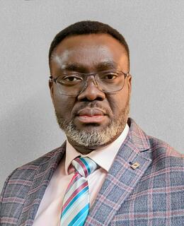 Headshot of Dr Agbani