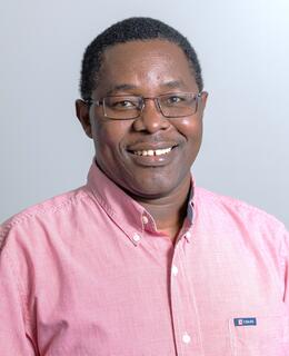 Dr. Francis Kahihu Kamau.